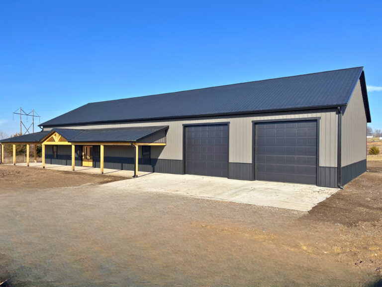 high-capacity 6-inch seamless gutter system with oversized downspouts on a modern gray