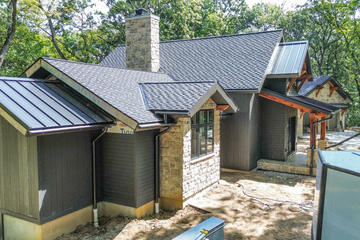 Home in Kearney, Missouri featuring 6-inch bronze half-round gutters and round downspouts installed by Gutter Tech.