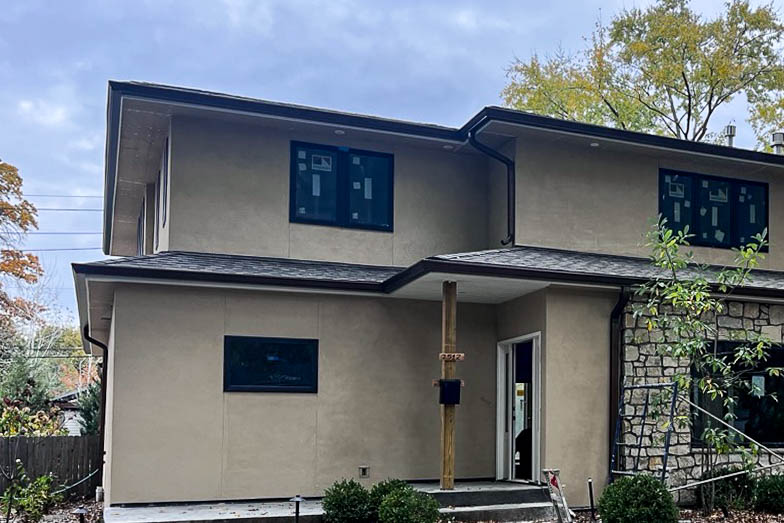 Close-up of a 6-inch copper aluminum gutter attached to a residential roofline in Leawood, Kansas.