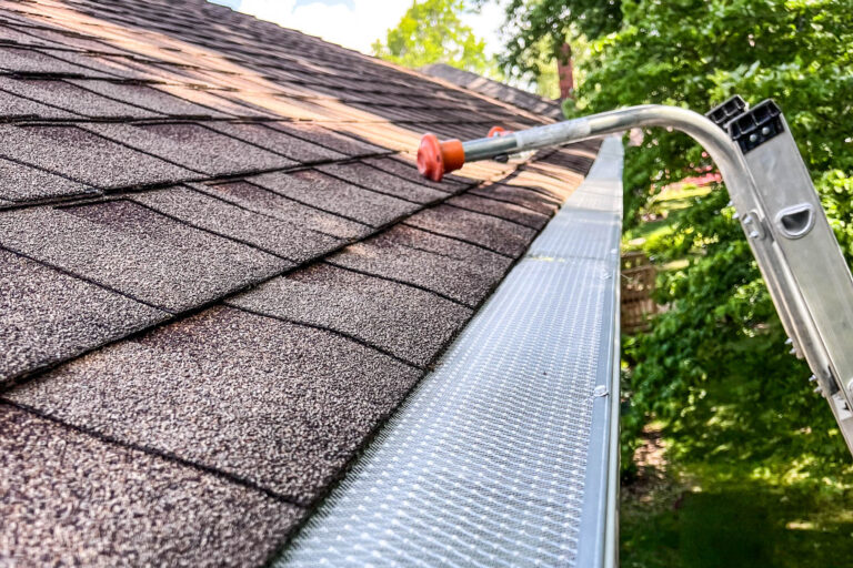 Close-up of new gutter system with micro-mesh leaf guard installed by Gutter Tech.